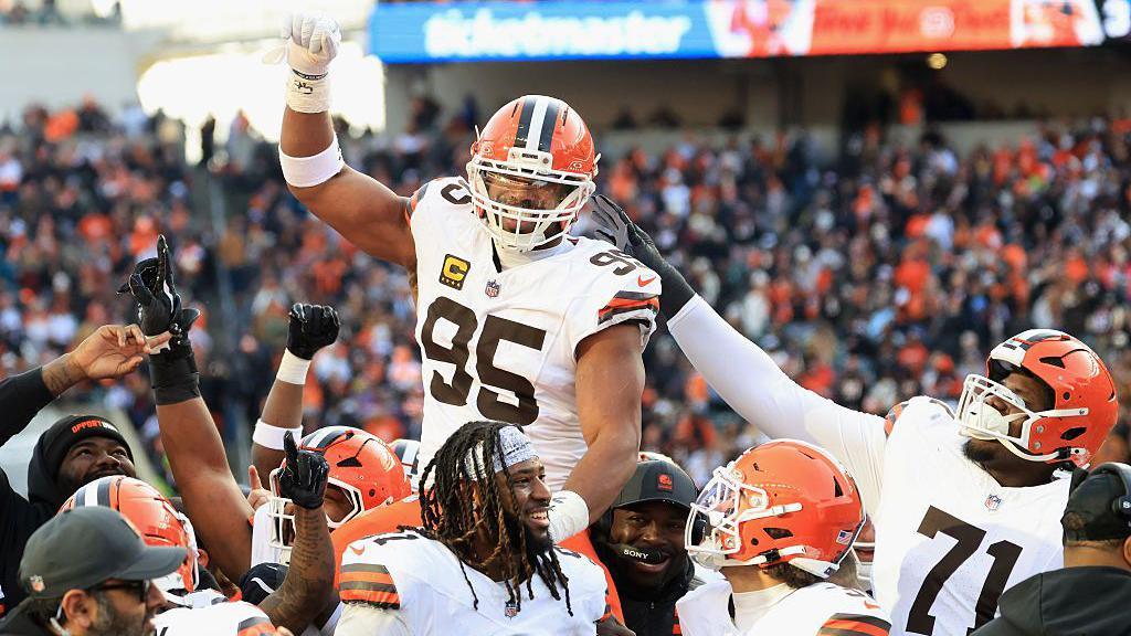 Myles Garrett carried by his Cleveland team-mates after breaking the NFL sack record