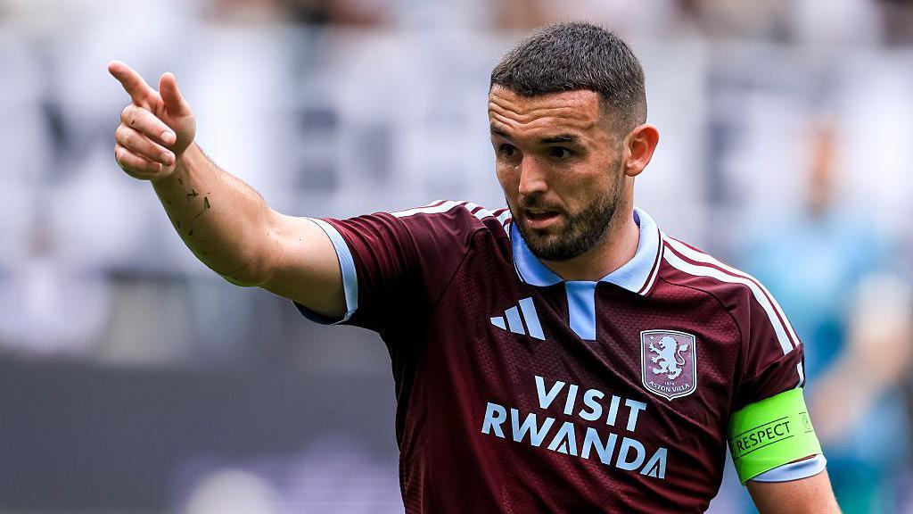 John McGinn of Aston Villa gestures