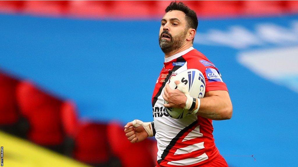 Salford Red Devils winger Rhys Williams scores against Leeds Rhinos in the 2020 Challenge Cup final