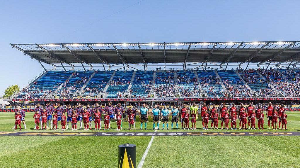 USA and Trinidad and Tobago line up before their Gold Cup match