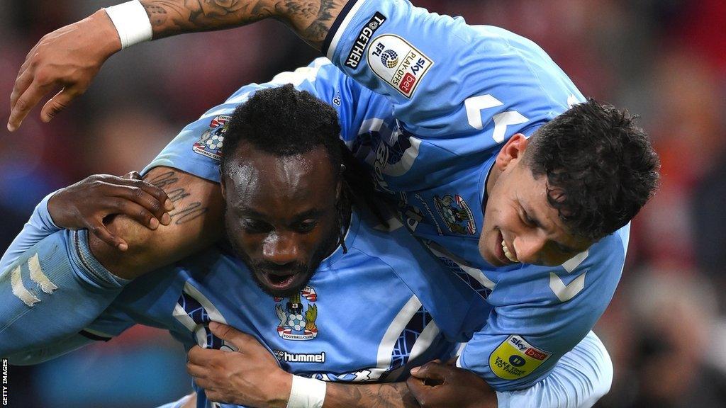 Coventry defender Fankaty Dabo treats Gus Hamer to a fireman's lift after firing the Sky Blues to Wembley