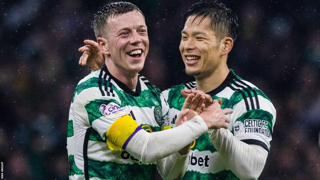 Celtic captain Callum McGregor (left)