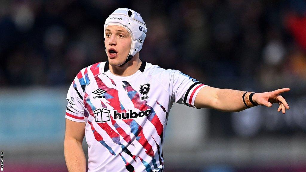 Fitz Harding points his arm across the pitch during a game for Bristol last season