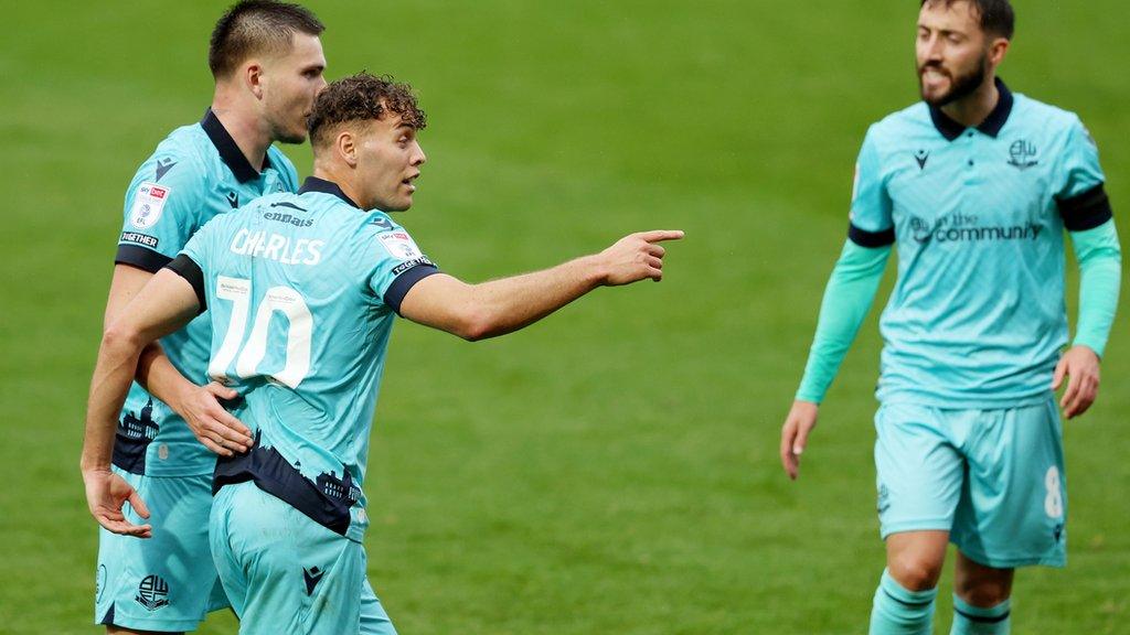 Dion Charles (centre) celebrates his goal for Bolton Wanderers against Port Vale