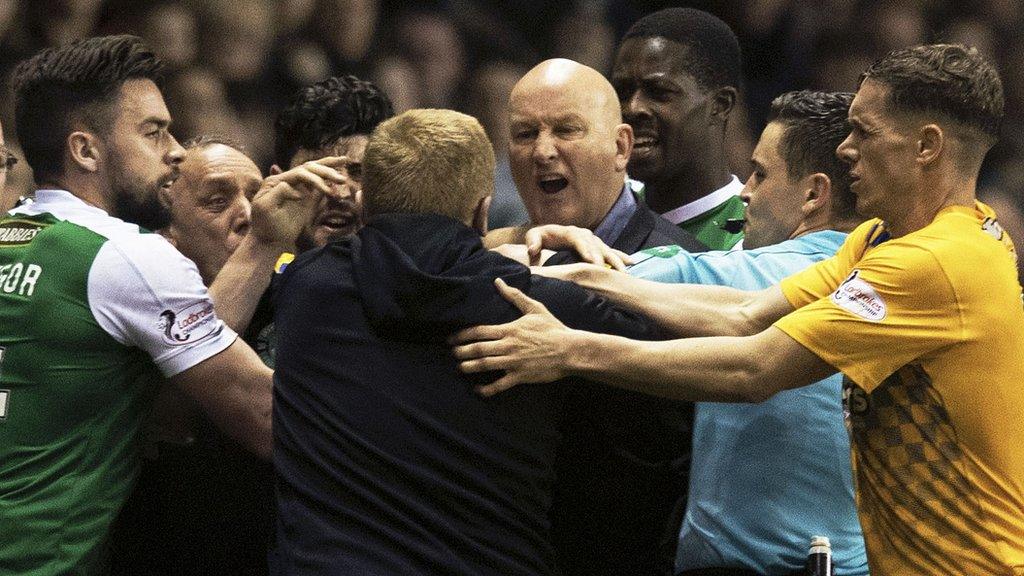 Hibernian and Morton players and managers become involved in a melee