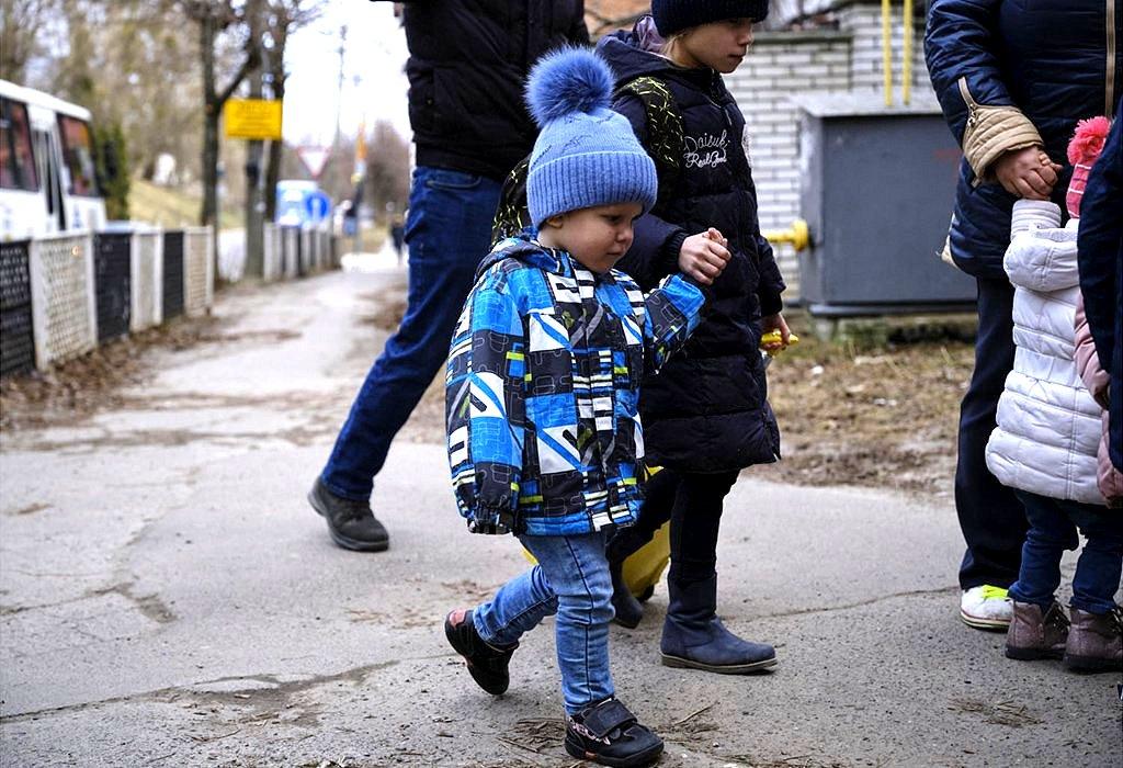 little boy held by the hand