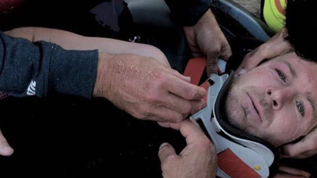 Surfer Andrew Cotton in a neck brace after breaking his back when he was crushed by a 60-foot wave