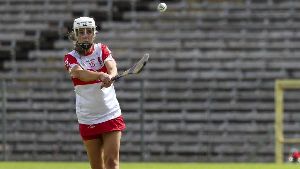 Aoife Shaw scoring a point from Derry