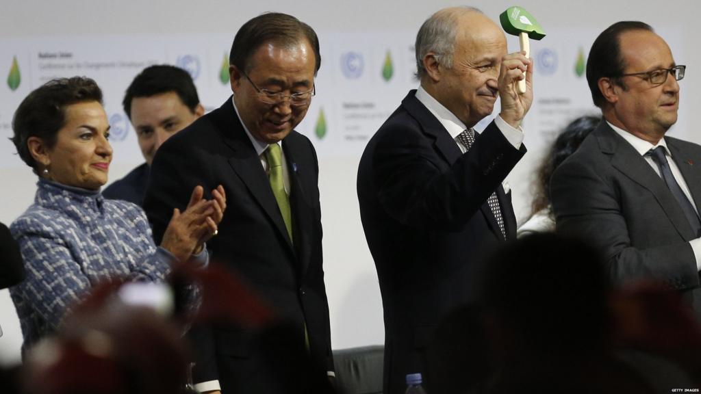 Laurent Fabius holding a green gavel