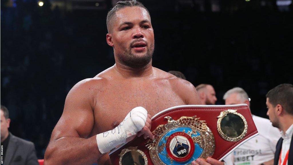 Joe Joyce poses with the WBO interim heavyweight belt after beating Joseph Parker