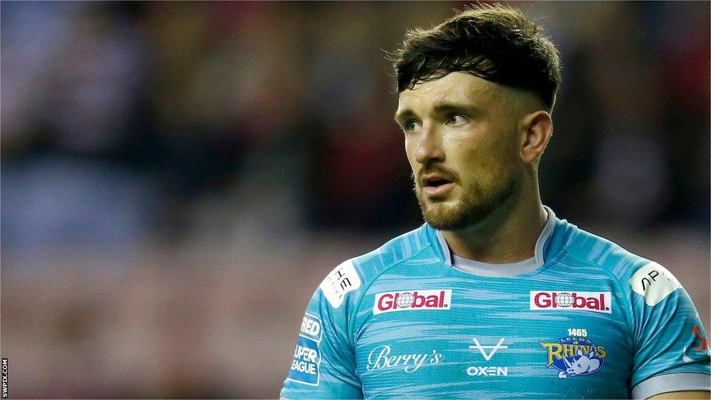 Liam Tindall looks on in Leeds' away shirt