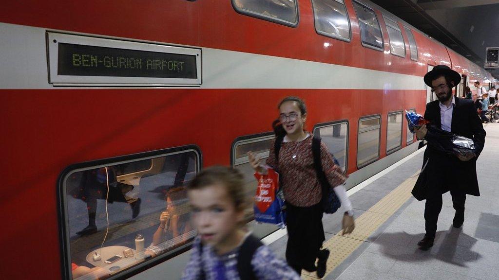 Passengers board Jerusalem-Tel Aviv train