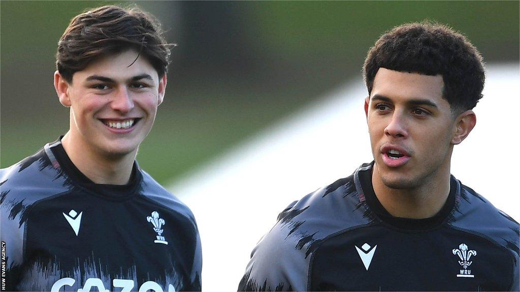 Louis Rees-Zammit (L) and Rio Dyer share a joke in Wales training