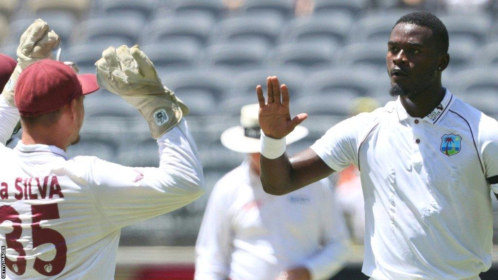 Jayden Seales (right) in action for West Indies