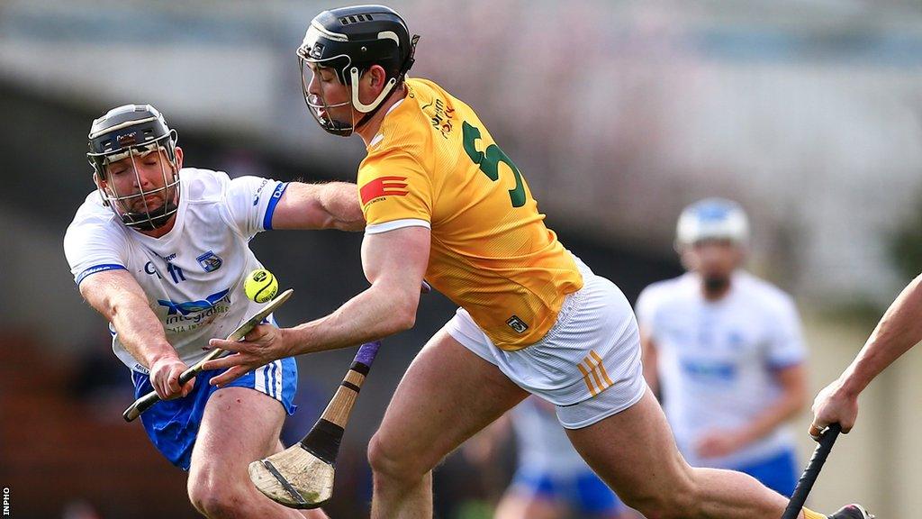 Waterford's Patrick Curran challenges Antrim's Gerard Walsh