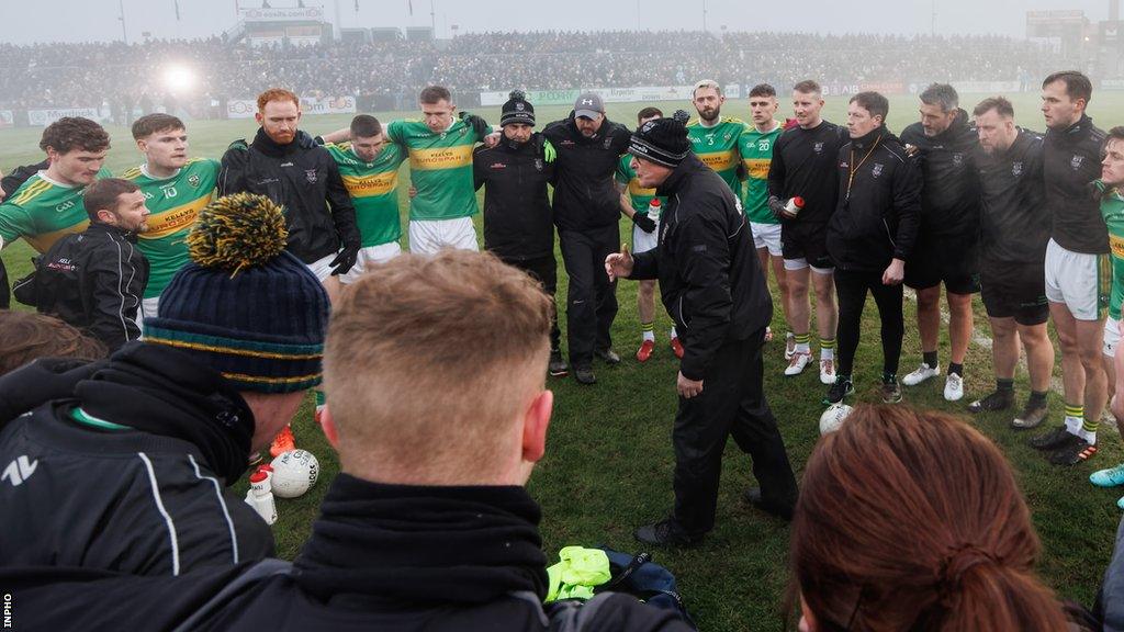 Malachy O'Rourke speaks to the Glen players prior to throw-in