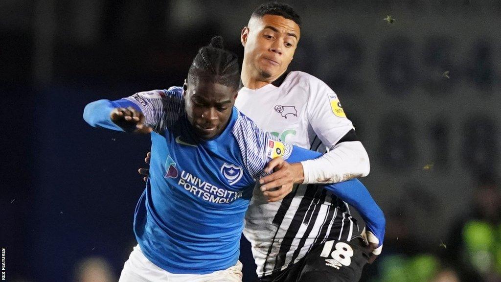 Portsmouth midfielder Jay Mingi is put under pressure by Derby forward Lewis Dobbin