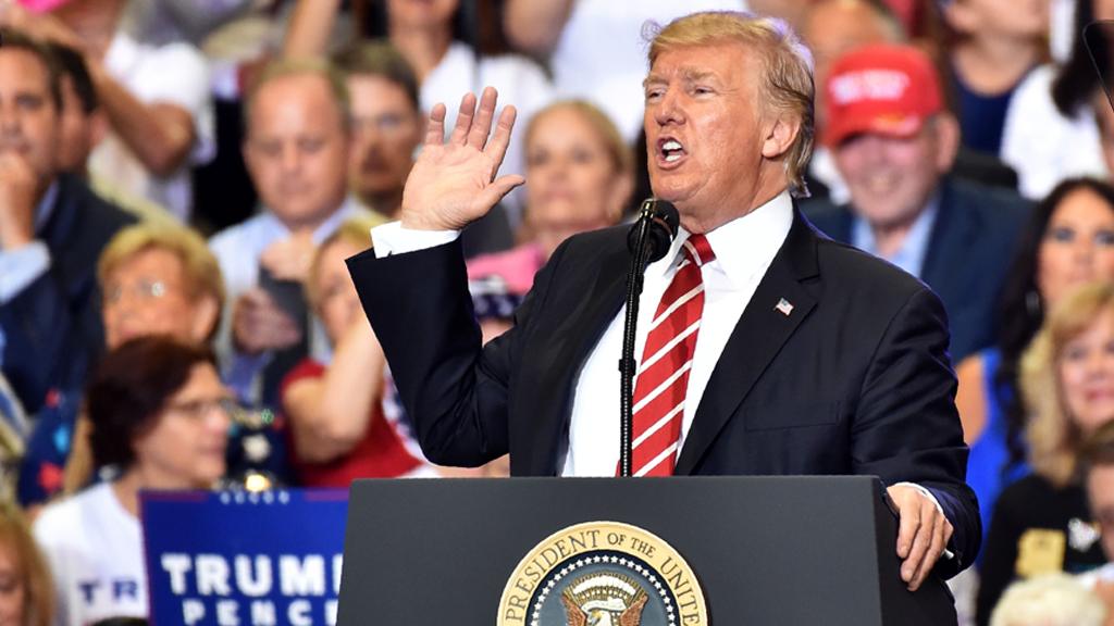 Donald Trump speaking in front of a crowd