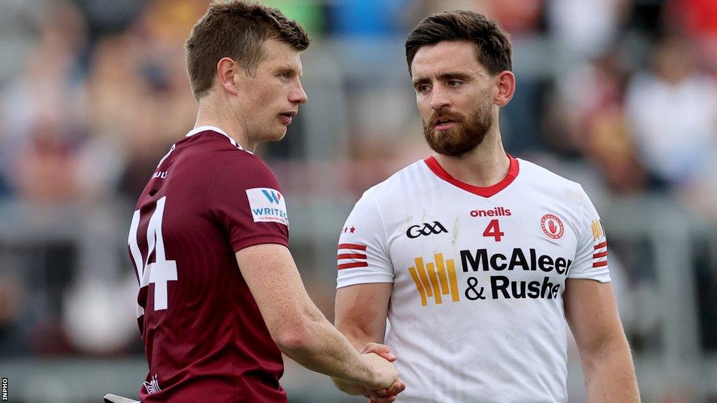 Tyrone's Padraig Hampsey shakes hands with Westmeath's John Heslin after the final whistle at Breffni Park