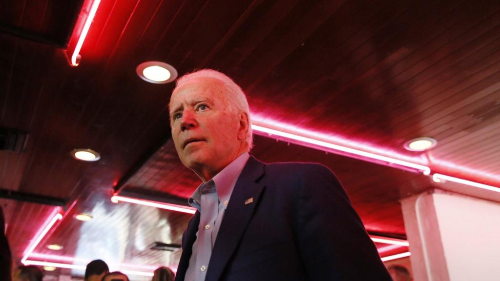 Joe Biden talks with customers at Roscoe"s Chicken and Waffles