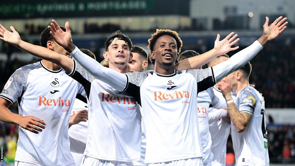 Jamal Lowe celebrates the opening goal with his team-mates