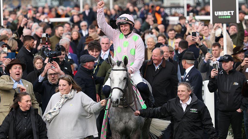 Paul Townend with his hand in the air in the Winners Enclosure with Lossiemouth