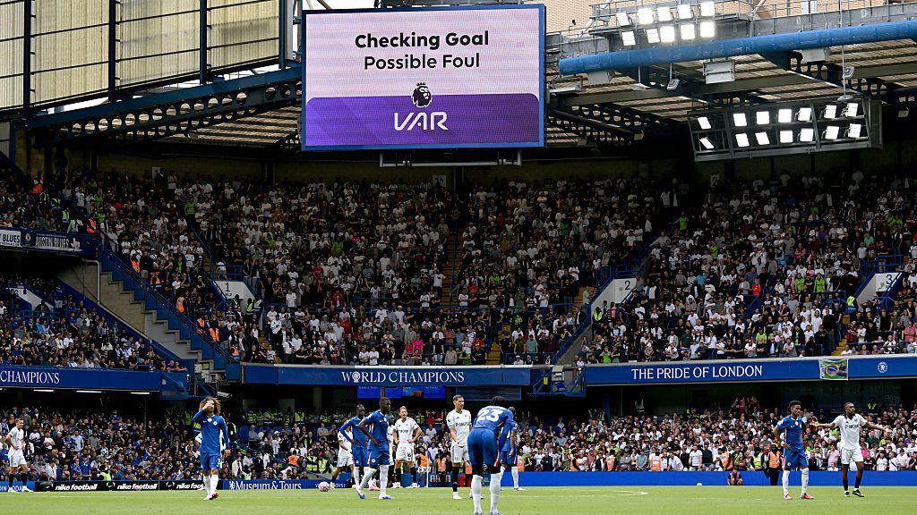 VAR review Joshua King's opener for Fulham at Stamford Bridge before disallowing the strike