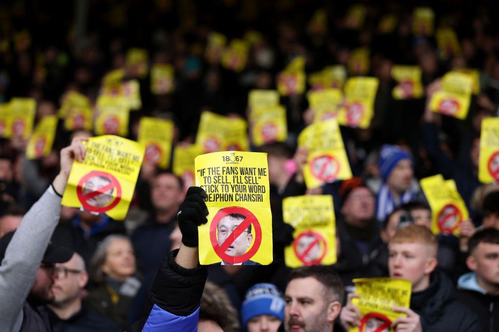 Sheffield Wednesday hold protest banners against Dejphon Chansiri's ownership of the club during a match