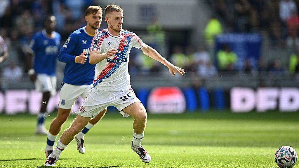 Adam Wharton dribbles forward for Crystal Palace during their Premier League defeat to Everton