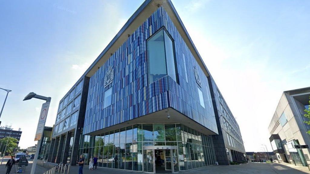 Doncaster Council HQ - a blue building with a coat of arms on one side.