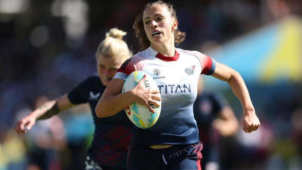 Lauren Torley runs in a try for Great Britain