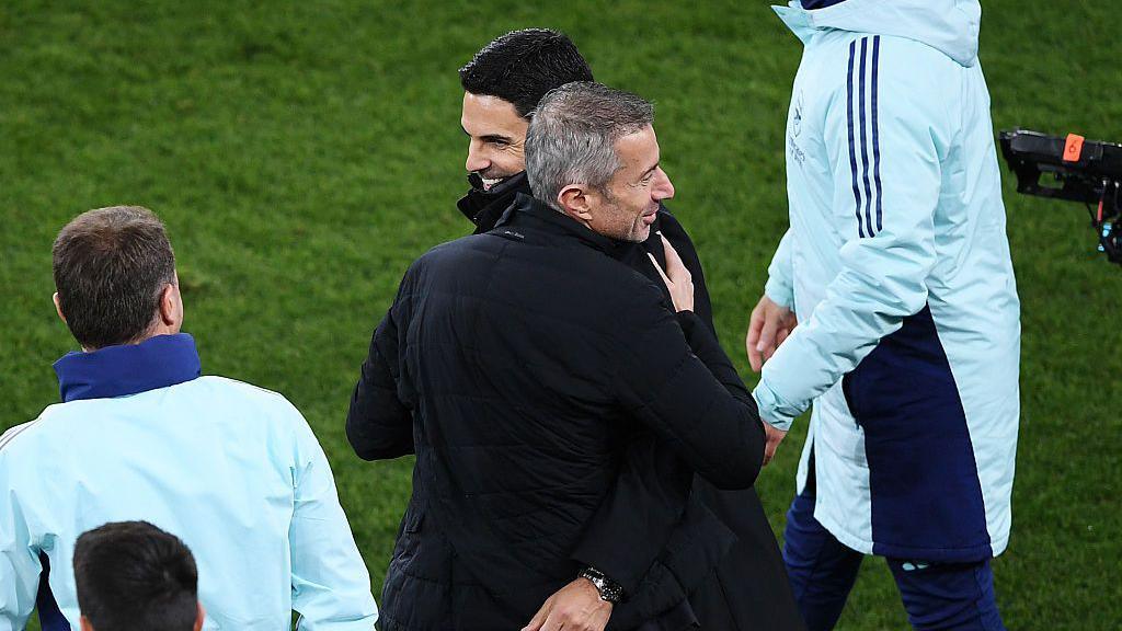 Mikel Arteta and Andrea Berta embrace