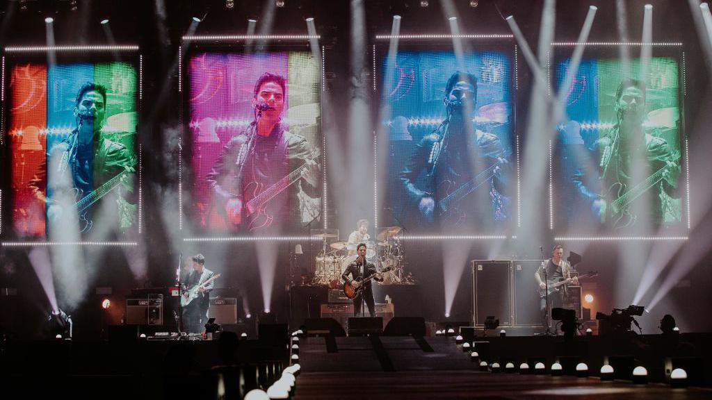 Stereophonics perform at Principality Stadium in Cardiff in 2022 with images of Kelly Jones singing above the stage on large screens