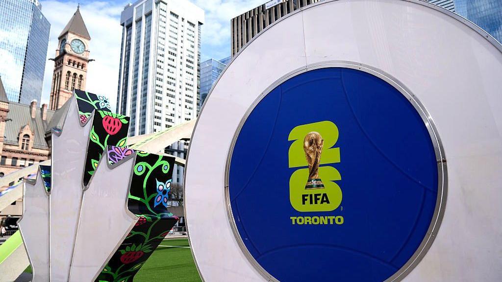 The Toronto sign decorated with FIFA World Cup graphics is seen at Nathan Phillips Square 