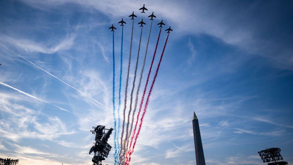 The Patrouille acrobatique de France perform a flyby whilst releasing smoke in the colours of the French flag during the opening ceremony of the Paris 2024 Summer Paralympic Games at the Place de la Concorde