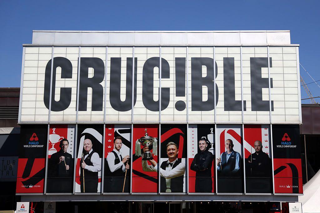Sheffield's Crucible Theatre during the World Snooker Championship, featuring large pictures of players covering large windows on the building