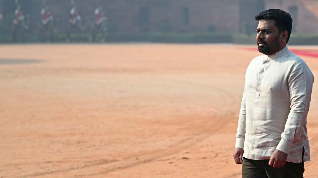 Anura Kumara Dissanayake in a white shirt walking during his ceremonial reception at the presidential palace Rashtrapati Bhavan in New Delhi