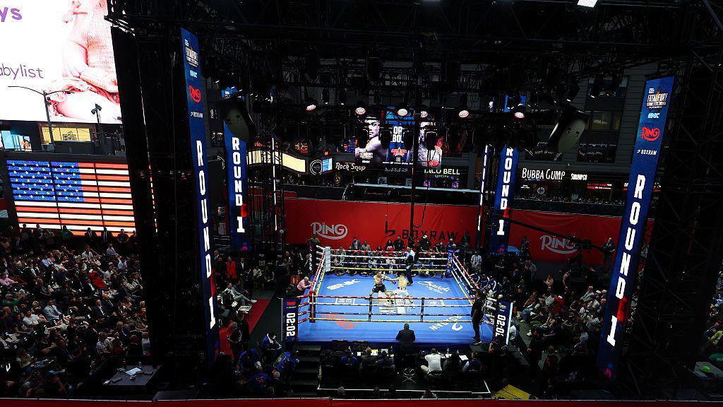 A view of Times Square with the boxing ring erected in the middle