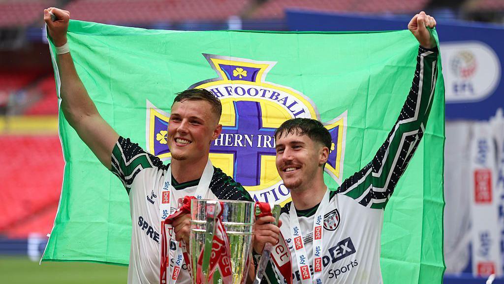Trai Hume and Dan Ballard celebrate promotion