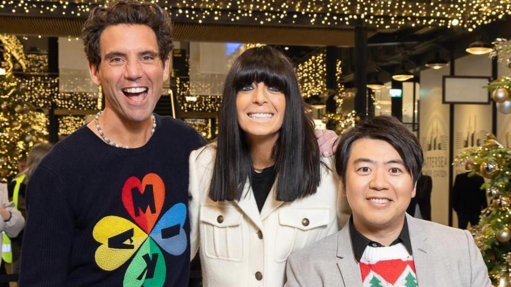 Claudia Winkleman, Mika and Lang Lang at Battersea Power Station, pictured under Christmas lights