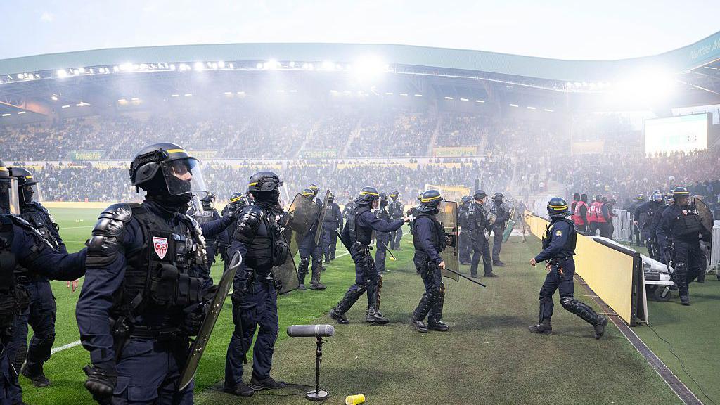Ligue 1 Match Abandoned as Nantes Fans Invade Pitch After Relegation