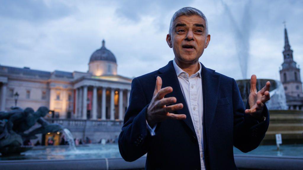 Sadiq Khan, wearing a suit, speaks to the media ahead of the open Iftar in Trafalgar Square on 8 April 2024 in London.
