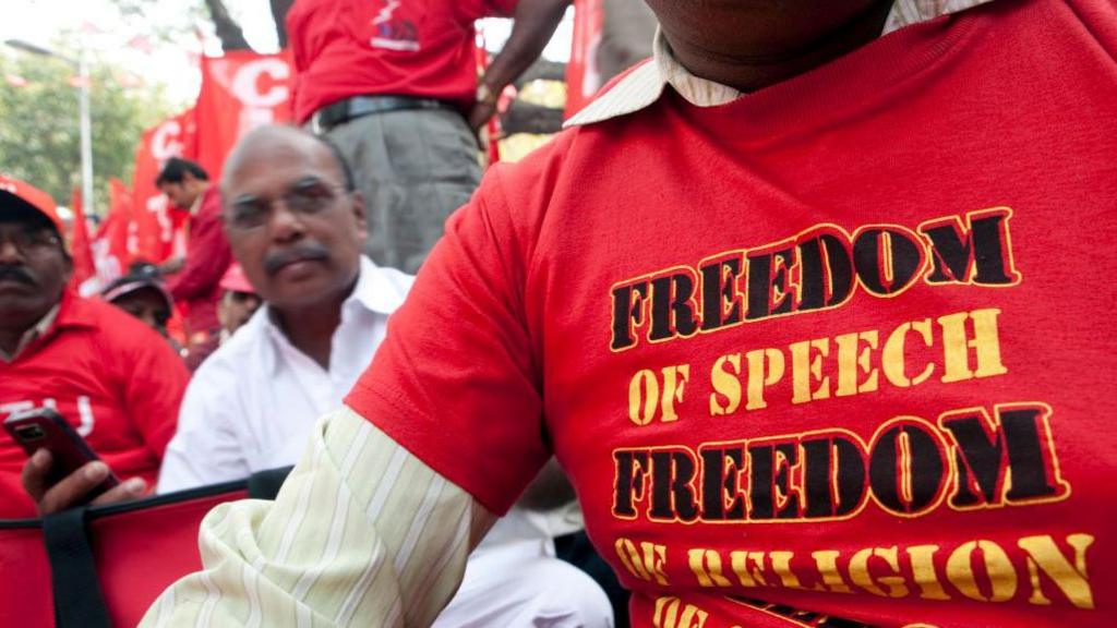 A trade union worker wears a T-shirt for freedom of speech, religion and choice, during a protest march to Parliament Street, in New Delhi, India, on Wednesday, Feb. 23, 2011. Thousands of workers from across India rallied by trade unions began a march toward the country's parliament in central New Delhi today protesting rising food prices, low wages and job security. Photographer: Prashanth Vishwanathan/Bloomberg via Getty Images