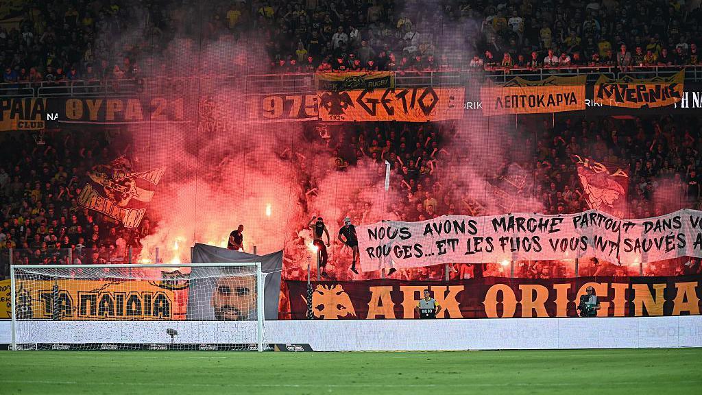 AEK supporters with pyrotechnics ahead of the Conference League qualifying match against Anderlecht