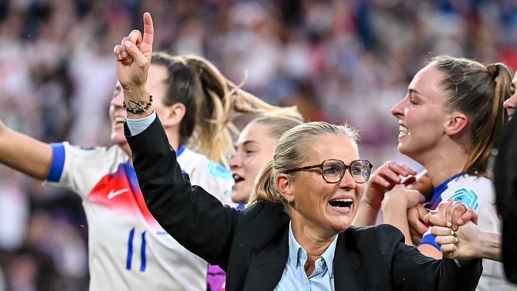 Sarina Wiegman celebrates with the England players after winning the Uefa European Women's Championship
