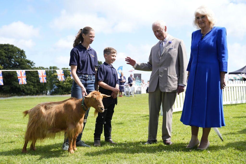 king and queen with goat