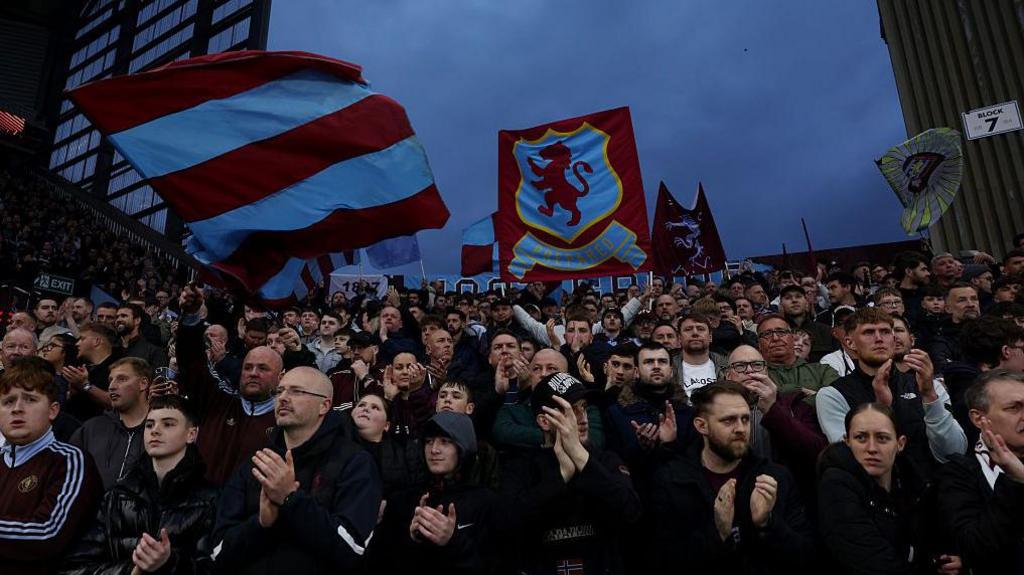 Aston Villa fans and flags at Villa Park