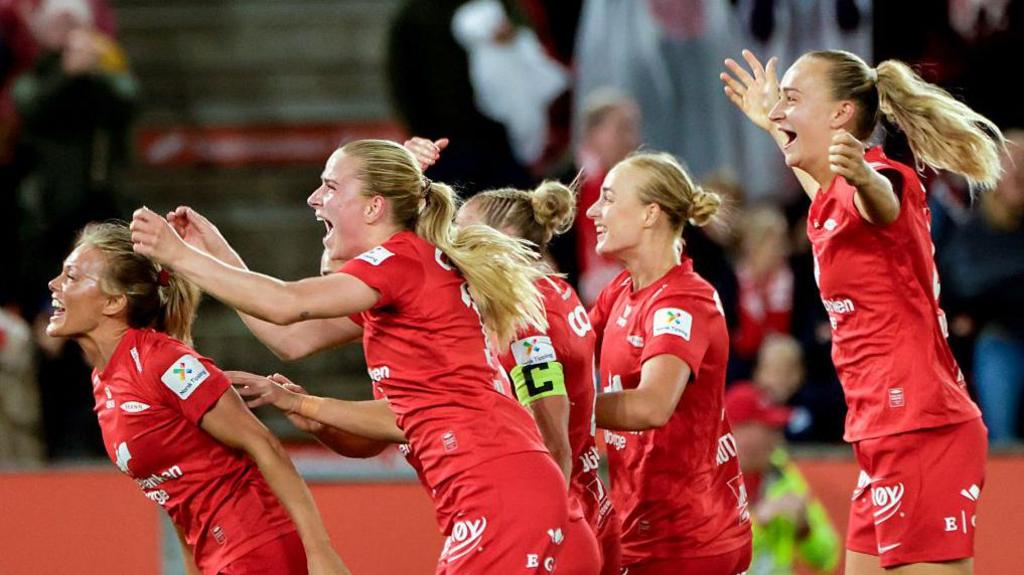 SK Brann's players celebrate their goal