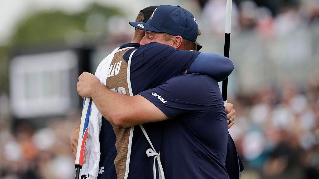 An emotional Bryson DeChambeau hugs his caddie after winning LIV South Africa with a play-off victory
