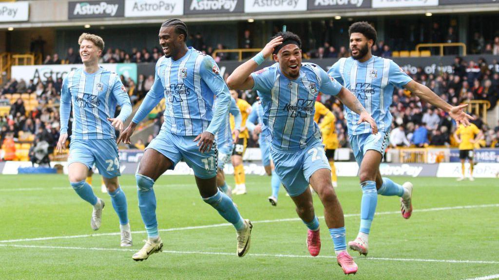 Coventry players celebrate their winning goal at Wolves in the FA Cup quarter-final